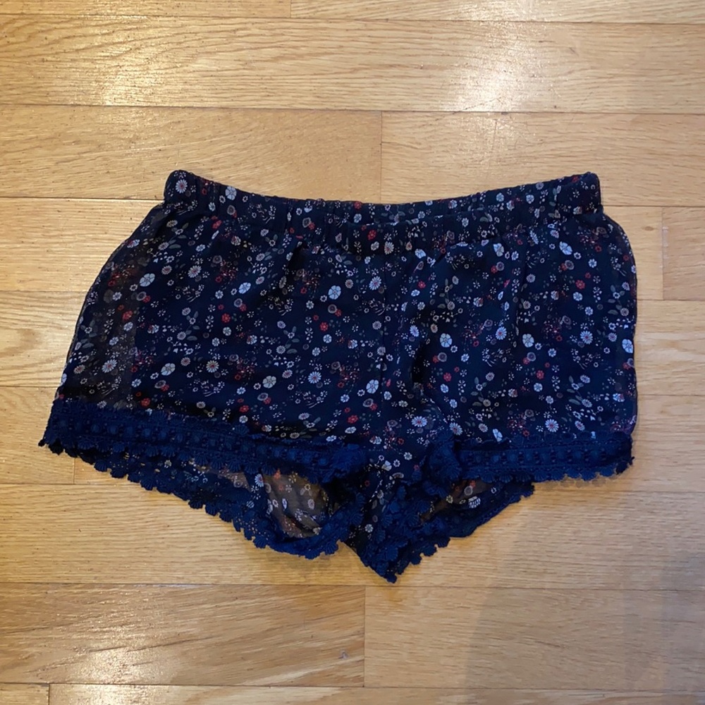 Short shorts! Sheer with built in black shorts underneath.